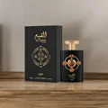 Al Qiam Gold Lattafa Pride edp perfume bottle on wooden table next black box side view