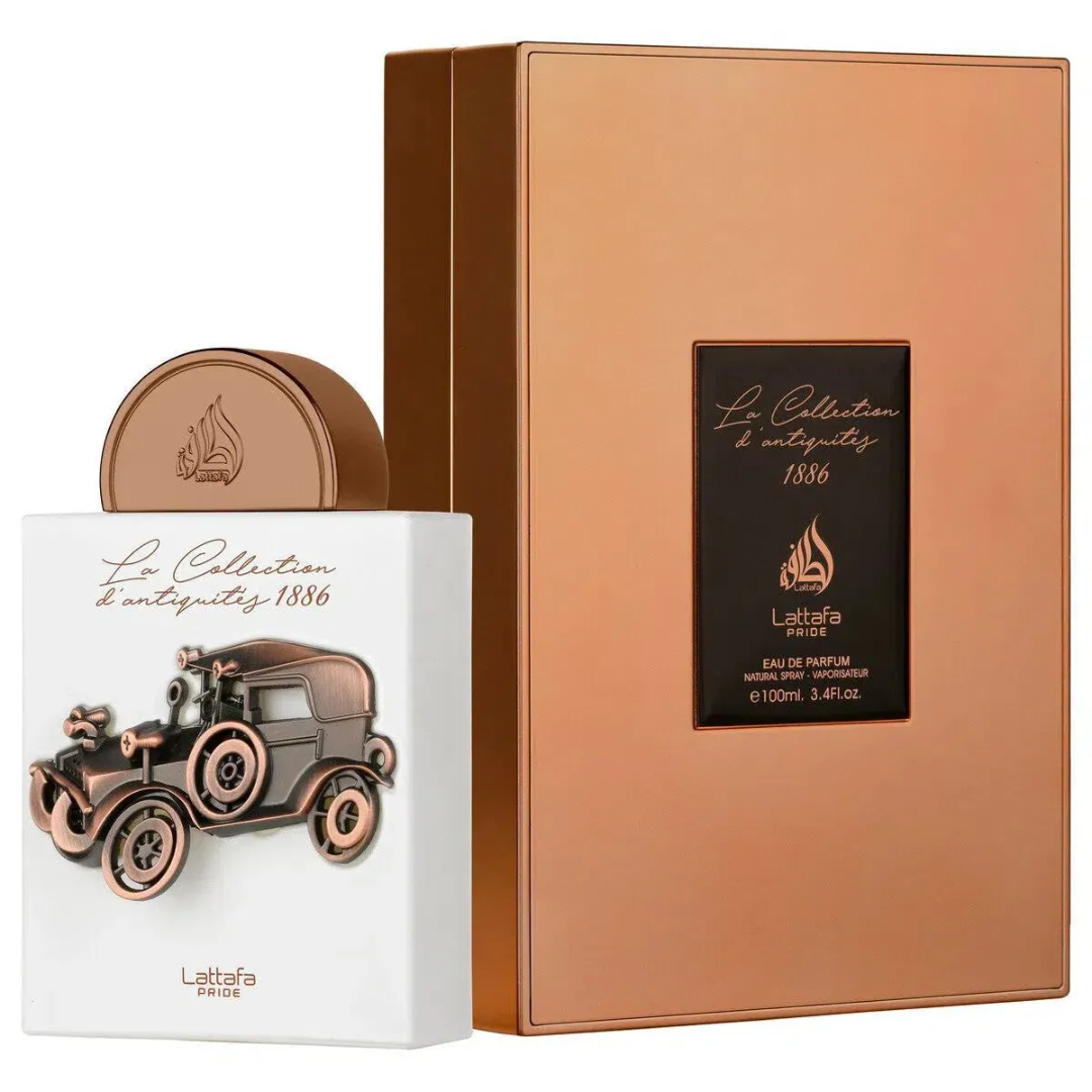 La Collection 1886 Car Lattafa Pride edp packaging beside white display case side angle