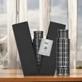 Pisa Lattafa Pride edp bottles unique leaning tower design wooden table closeup