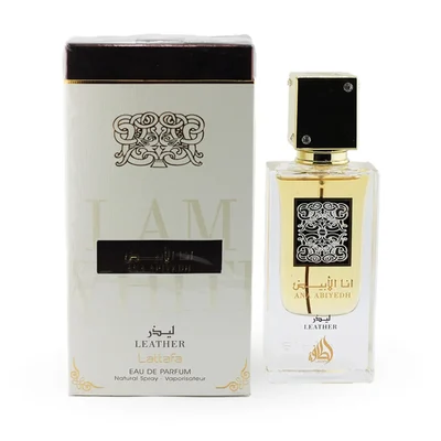 Lattafa Ana Abiyedh Leather 60ml — White perfume box and glass bottle with gold accents and Arabic calligraphy, showing the product packaging and bottle design. | Kotak minyak wangi putih dan botol kaca dengan aksen emas dan kaligrafi Arab, menunjukkan pembungkusan produk dan reka bentuk botol.