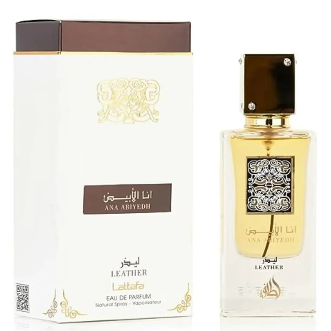 Lattafa Ana Abiyedh Leather 60ml — White perfume box and glass bottle with gold accents and Arabic calligraphy, showing the product packaging and bottle design. | Kotak minyak wangi putih dan botol kaca dengan aksen emas dan kaligrafi Arab, menunjukkan pembungkusan produk dan reka bentuk botol.