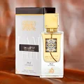 Lattafa Ana Abiyedh Leather 60ml — White perfume box and glass bottle with gold accents and Arabic calligraphy, showing the product packaging and bottle design. | Kotak minyak wangi putih dan botol kaca dengan aksen emas dan kaligrafi Arab, menunjukkan pembungkusan produk dan reka bentuk botol.