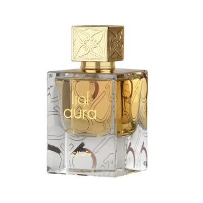 Lattafa Aura Lattafa 60ml EDP — A clear glass perfume bottle with gold liquid and a decorative gold cap sits next to its white and red box with gold topographic line art. | Lattafa Aura Lattafa 60ml EDP — Botol minyak wangi kaca jernih dengan cecair emas dan penutup emas hiasan terletak di sebelah kotak putih dan