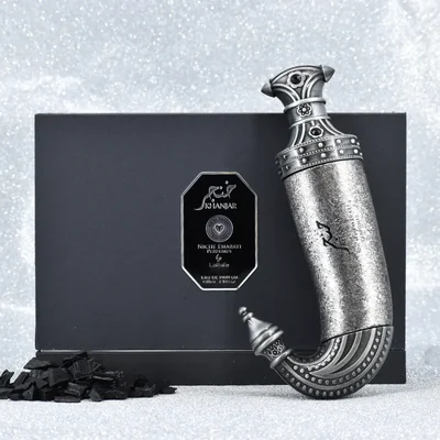 Niche Emarati Khanjar by Niche Emarati 85ml EDP — Black box with silver label and ornate dagger-shaped perfume bottle