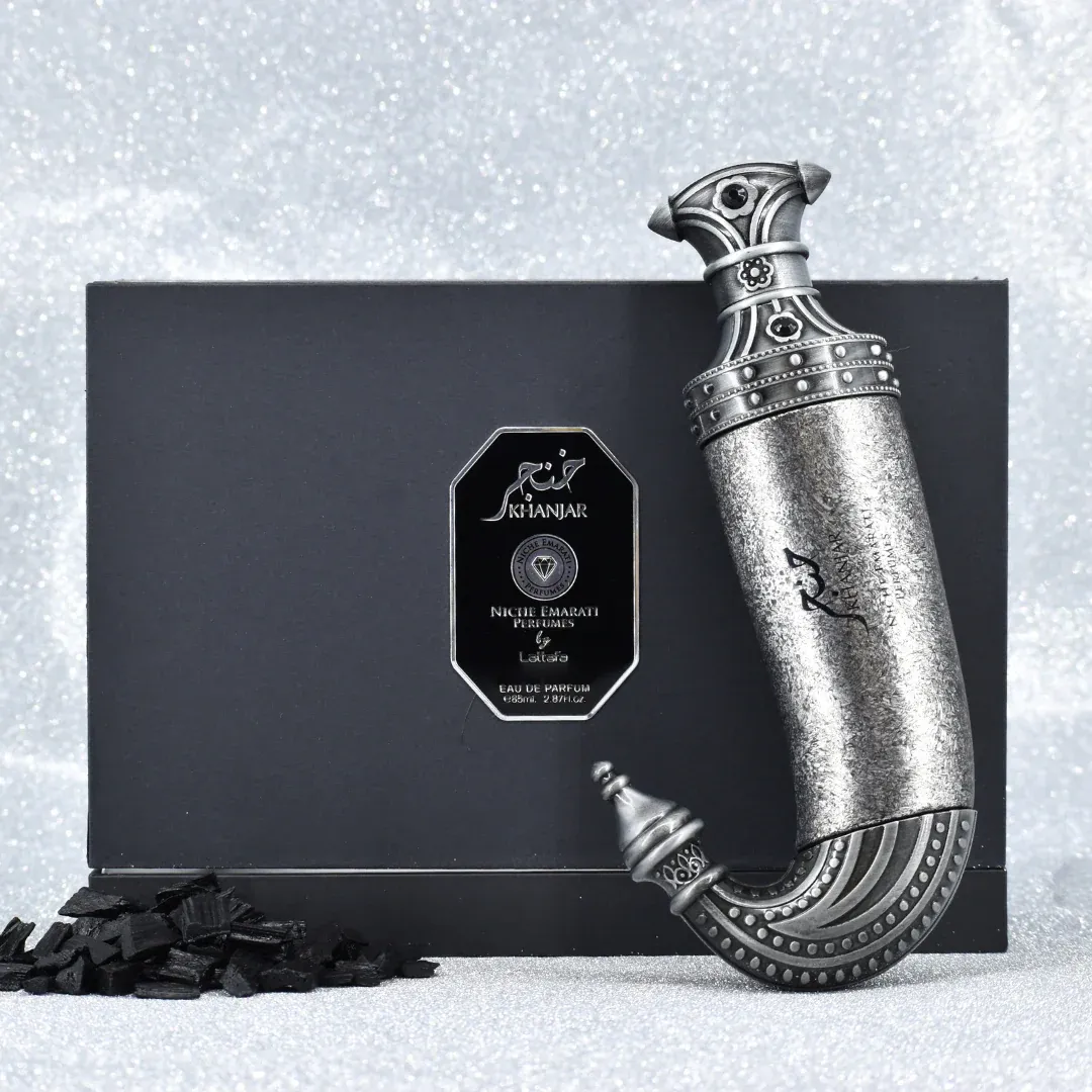 Niche Emarati Khanjar by Niche Emarati 85ml EDP — Black box with silver label and ornate dagger-shaped perfume bottle