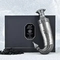 Niche Emarati Khanjar by Niche Emarati 85ml EDP — Black box with silver label and ornate dagger-shaped perfume bottle