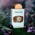 Lattafa Pride Vintage Radio edp surrounded by flowers purple background brown packaging closeup view side profile