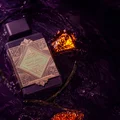 Lattafa Bade'e Al Oud Amethyst Fusion 100ml — A purple perfume bottle with a dark grey cap and a gold and light green geometric label. | Lattafa Bade'e Al Oud Amethyst Fusion 100ml — Botol minyak wangi ungu dengan penutup kelabu gelap dan label geometri emas dan hijau muda.