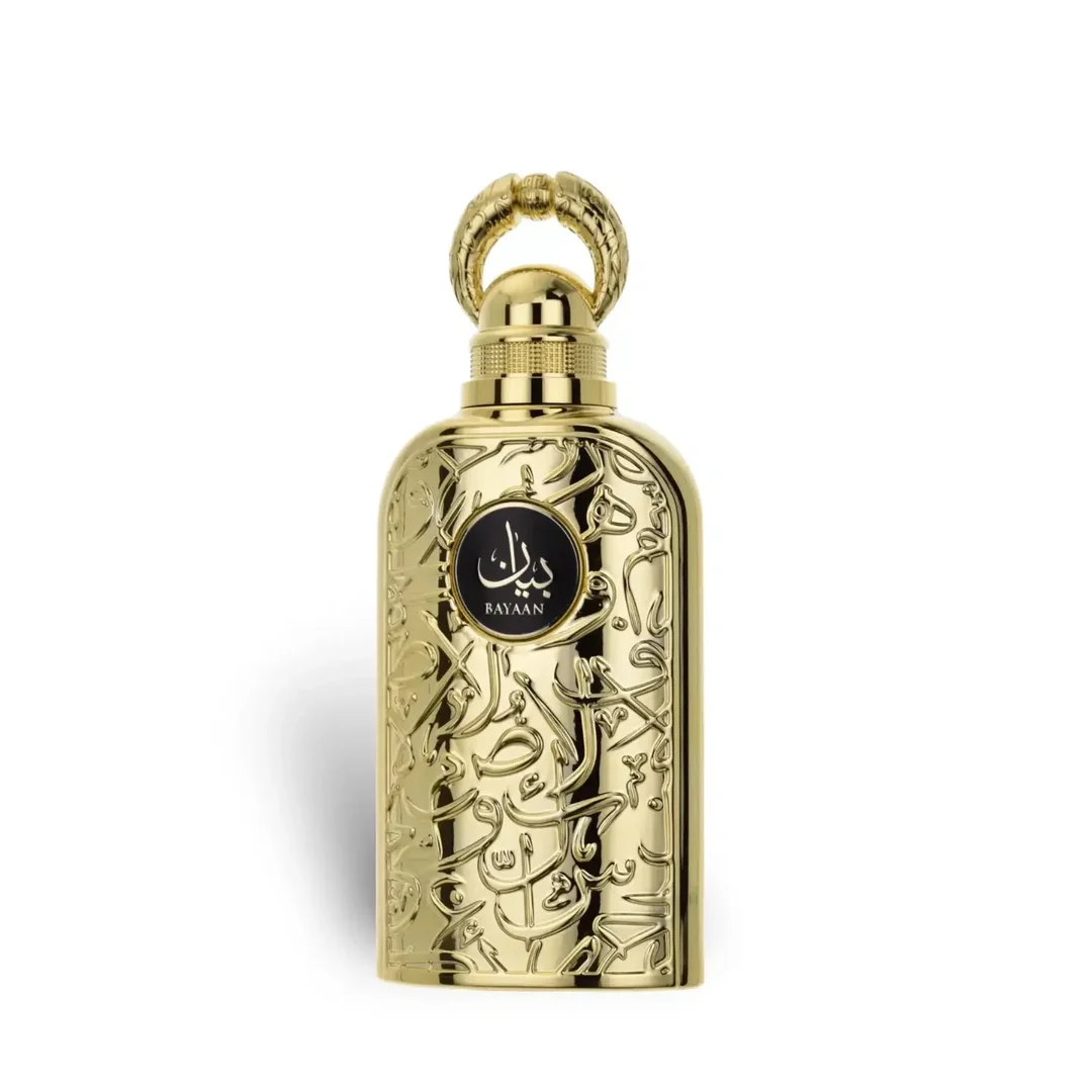 Lattafa Bayaan Eau De Parfum 100ml by Lattafa — A golden perfume bottle with intricate Arabic calligraphy design, presented in a white box with a matching golden outer sleeve featuring similar calligraphy. | Lattafa Bayaan Eau De Parfum 100ml by Lattafa — Botol minyak wangi emas dengan reka bentuk kaligrafi Arab yang