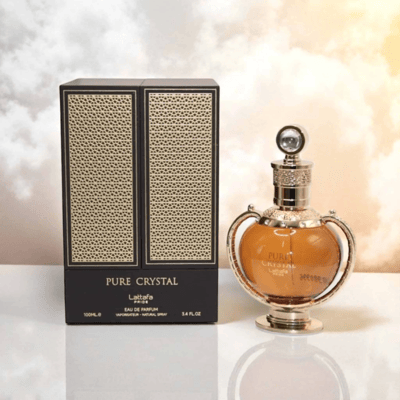 Lattafa Pride Pure Crystal edp in elegant packaging on white surface against cloudy background closeup view