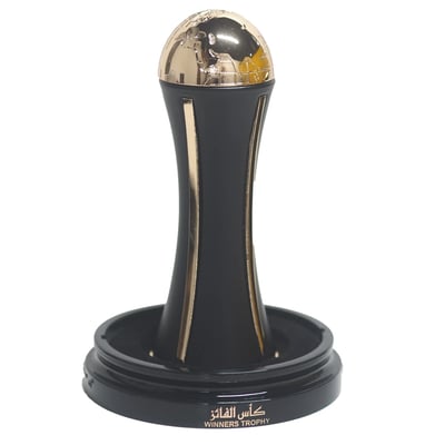 Lattafa Pride Al Khas Winners Trophy Gold 100ml — A dark blue box with gold text and a matching dark blue and gold globe-topped perfume bottle, displayed against a white background. | Lattafa Pride Al Khas Winners Trophy Gold 100ml — Kotak biru gelap dengan teks emas dan botol minyak wangi bertopi dunia biru gelap dan