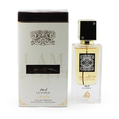 Lattafa Ana Abiyedh Leather 60ml — White perfume box and glass bottle with gold accents and Arabic calligraphy, showing the product packaging and bottle design. | Kotak minyak wangi putih dan botol kaca dengan aksen emas dan kaligrafi Arab, menunjukkan pembungkusan produk dan reka bentuk botol.