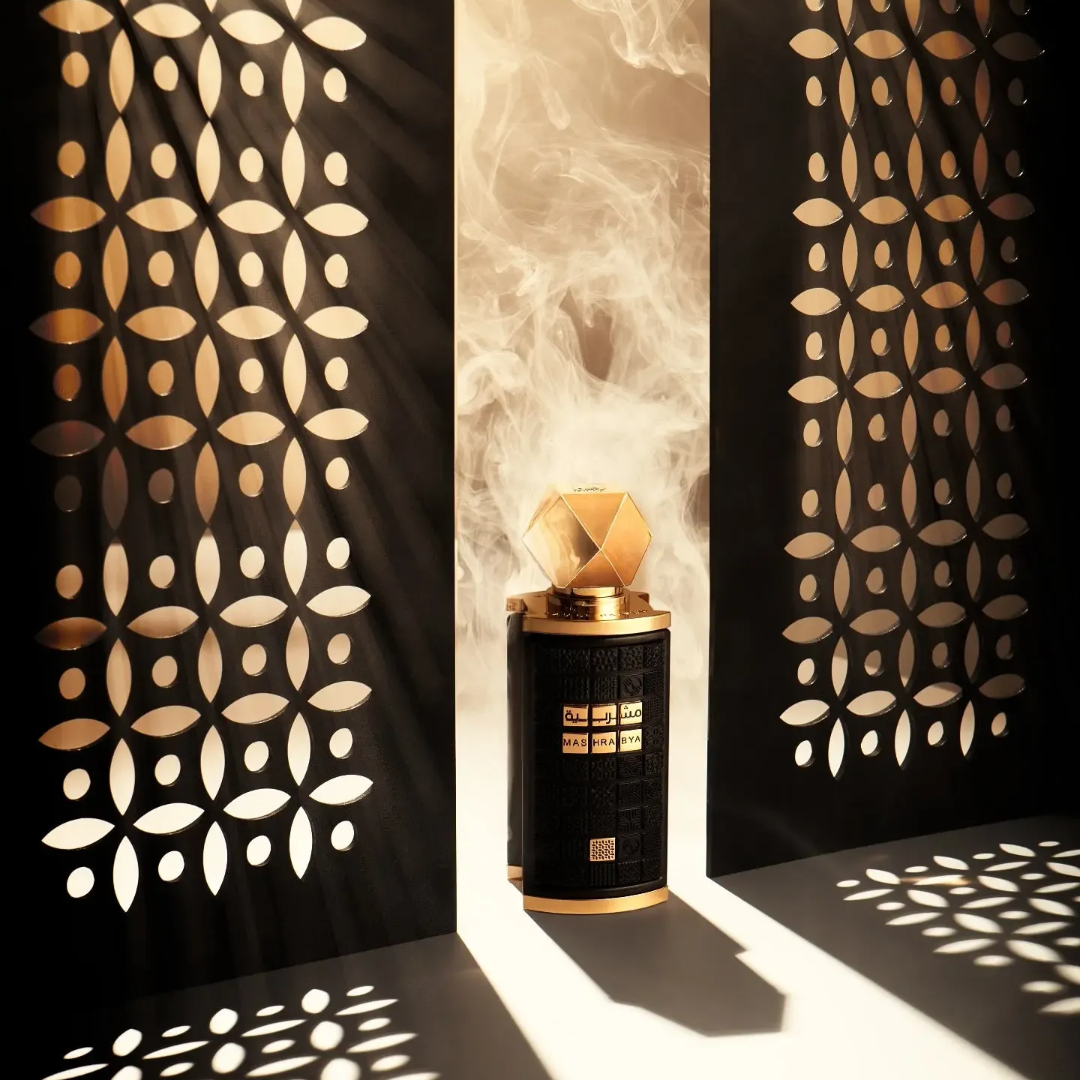 Mashrabya Lattafa edp fragrance black cylindrical glass surrounded smoke table top closeup