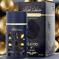Lattafa Khalta Blend Of Lattafa Eau De Parfum 100ml — A dark blue perfume bottle with a textured, carved outer layer revealing gold accents inside, next to its matching cap with a gold circular emblem. | Lattafa Khalta Blend Of Lattafa Eau De Parfum 100ml — Botol minyak wangi biru gelap dengan lapisan luar bertekstur