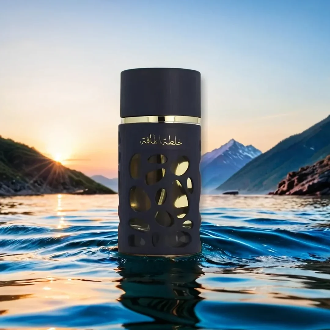 Lattafa Khalta Blend Of Lattafa Eau De Parfum 100ml — A dark blue perfume bottle with a textured, carved outer layer revealing gold accents inside, next to its matching cap with a gold circular emblem. | Lattafa Khalta Blend Of Lattafa Eau De Parfum 100ml — Botol minyak wangi biru gelap dengan lapisan luar bertekstur