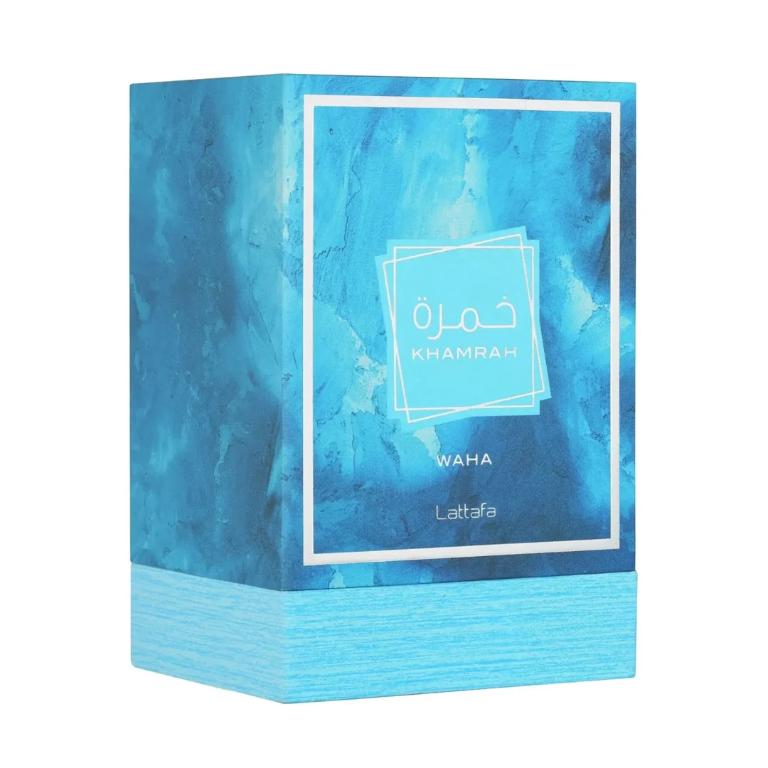 Lattafa Khamrah Waha Lattafa Perfumes 100ml EDP — A clear glass perfume bottle with a textured cap sits next to its blue