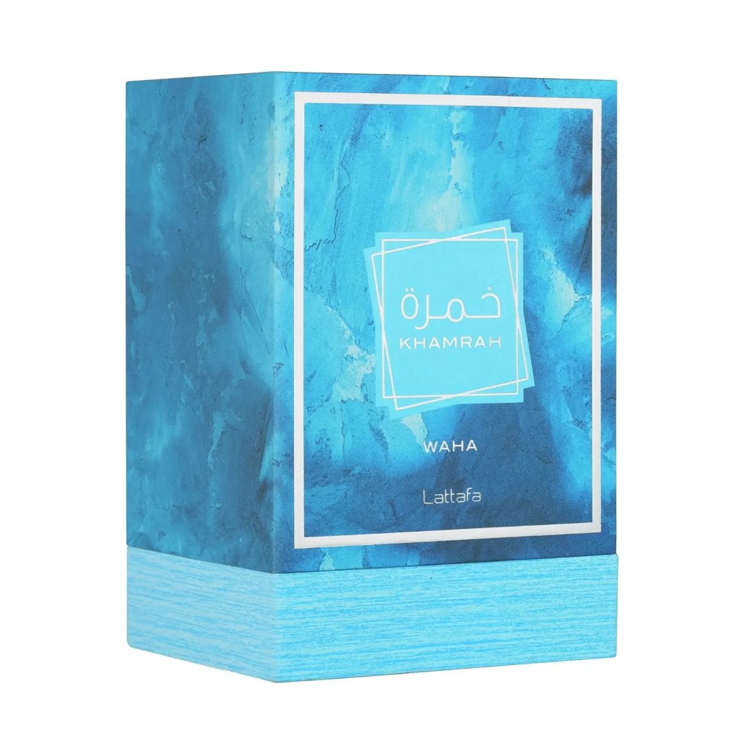Lattafa Khamrah Waha Lattafa Perfumes 100ml EDP — A clear glass perfume bottle with a textured cap sits next to its blue