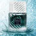 Lattafa Khamrah Waha Lattafa Perfumes 100ml EDP — A clear glass perfume bottle with a textured cap sits next to its blue