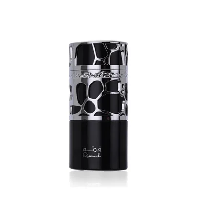 Lattafa Qimmah Eau De Parfum for Men 100ml — A black and silver perfume box with a pattern of irregular black shapes on a silver background, next to a black perfume bottle with a silver cap featuring a similar pattern. | Lattafa Qimmah Eau De Parfum for Men 100ml — Kotak minyak wangi hitam dan perak dengan corak