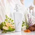 Lattafa Maahir Honor 100ml by Lattafa — White perfume bottle with a horse head stopper, tied with a white ribbon, inside an open white box with a cutout flap | Lattafa Maahir Honor 100ml by Lattafa — Botol minyak wangi putih dengan penutup kepala kuda, diikat dengan reben putih, di dalam kotak putih terbuka dengan