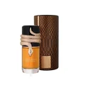 Lattafa Musamam Eau De Parfum 100ml by Lattafa — A golden snake coils around a clear glass perfume bottle filled with amber liquid, next to a textured brown cylindrical case with a snake-skin pattern. | Lattafa Musamam Eau De Parfum 100ml by Lattafa — Ular emas melilit botol minyak wangi kaca jernih berisi cecair