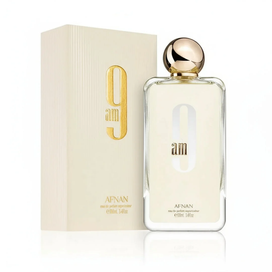 Afnan 9 AM by Afnan 100 ml EDP Unisex — clear glass bottle, gold cap, cream box, plain white background