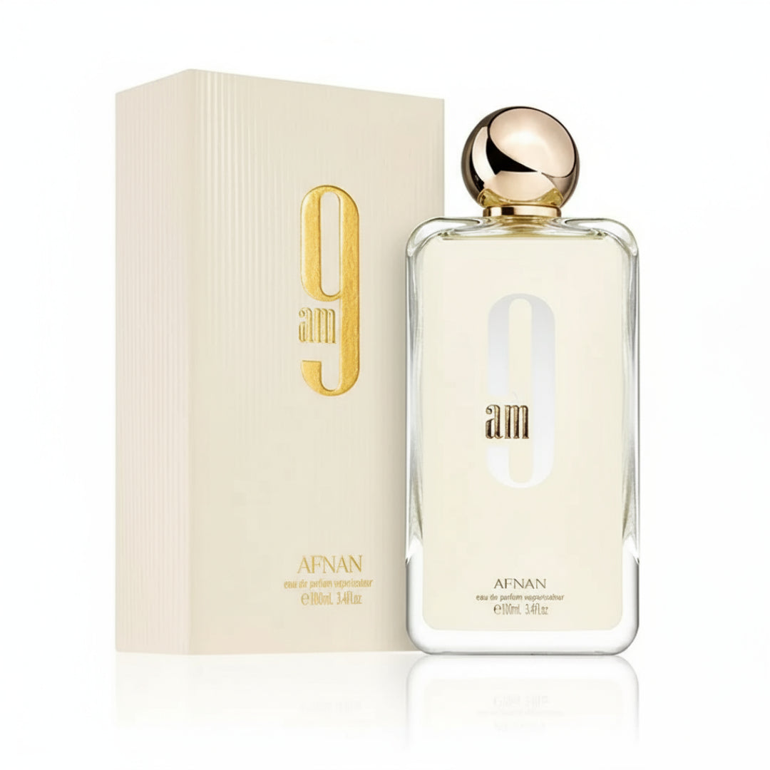 Afnan 9 AM by Afnan 100 ml EDP Unisex — clear glass bottle, gold cap, cream box, plain white background