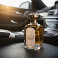 Afkaar Lattafa edp bottle inside car interior dashboard