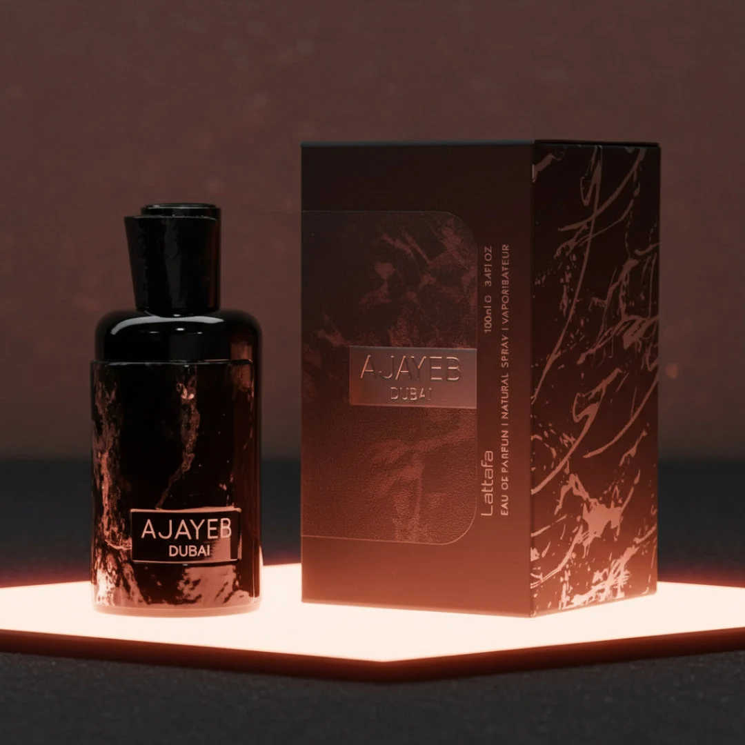 Ajayeb Dubai Lattafa edp black marble design packaging on lit platform closeup