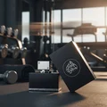 Al Dur Al Maknoon Silver Lattafa edp on black gym floor next dumbbells equipment