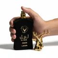 Hand holding Al Noble Ameer Lattafa black gold deer head sprayer closeup side