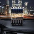 Al Azal Lattafa edp in car dashboard night city view Malaysia closeup