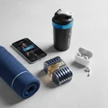 Al Azal Lattafa edp on table next blue towel water bottle phone earbuds