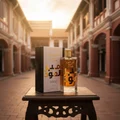 Ameer Al Oudh Intense Lattafa edp on small table outdoors Malaysia building