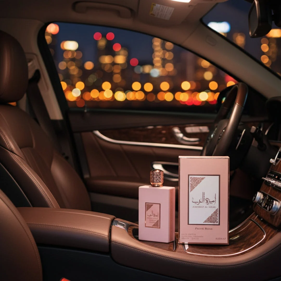 Ameerat Al Arab Prive Rose Lattafa car interior pink boxes display nighttime
