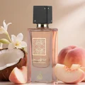 Ana Abiyedh Coral Lattafa edp pink glass surrounded peaches coconut flower beige background