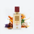 Ana Abiyedh Rouge Lattafa edp perfume bottle surrounded flowers spices white background