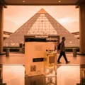Ana Abiyedh Lattafa pyramid mall shopping center glass table display reflection