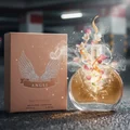 Angel LaMuse Lattafa edp packaging pink surrounded flowers smoke effect closeup