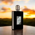 Ameer Al Arab Asdaaf men fragrance black packaging on table outdoors sunset