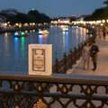 Badee Al Oud Honor Glory Lattafa boxed on bridge railing near river dusk
