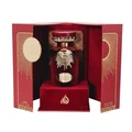 Sakeena Lattafa red velvet case gold-edged dark red glass fragrance container on stand