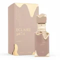 Eclaire Lattafa edp women fragrance pinkish gold packaging white background closeup
