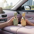 Eclaire Pistache Lattafa unisex edp bottles in car interior pink seat closeup