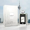 Ejaazi Intensive Lattafa silver unisex perfume bottle and box white cityscape background