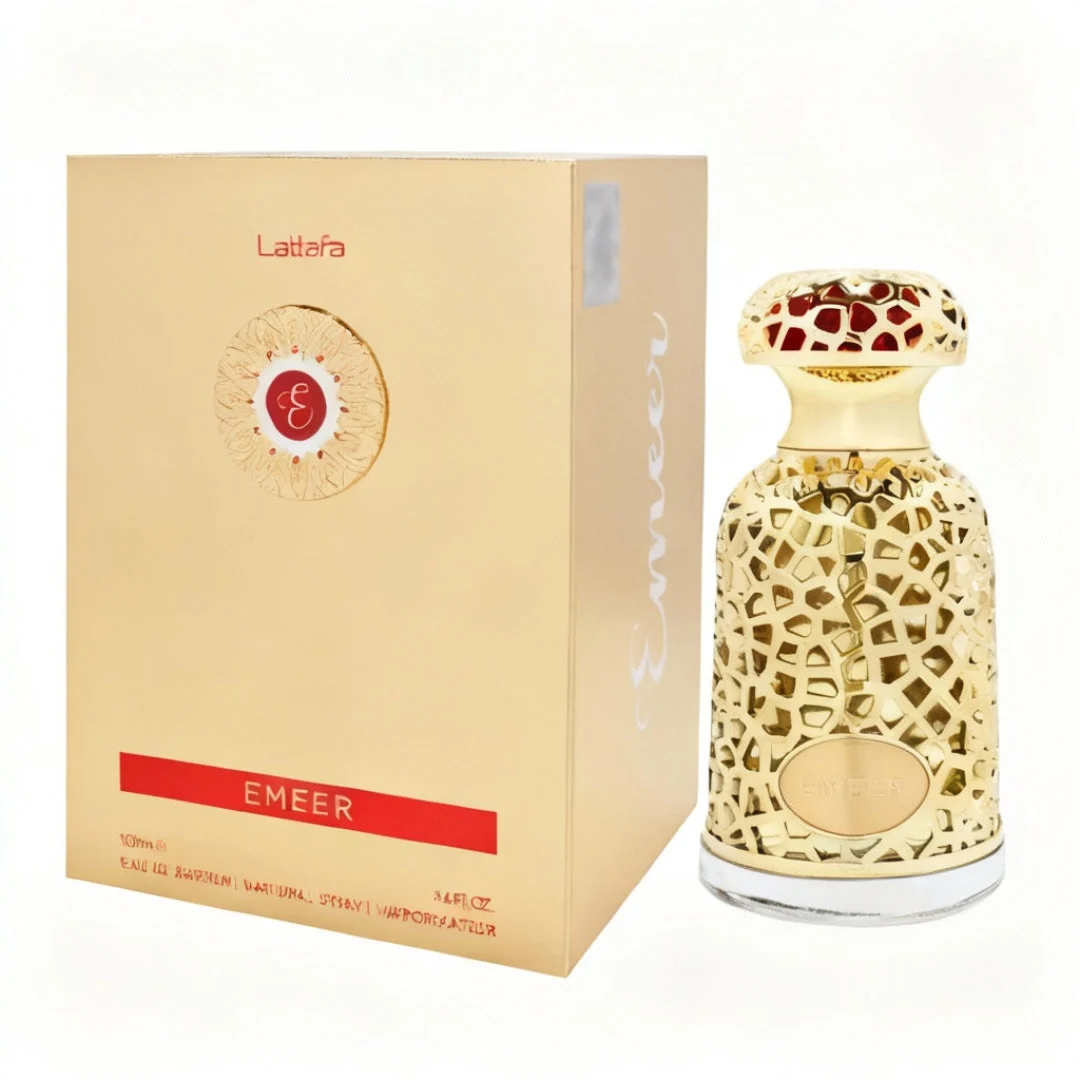 Emeer Lattafa golden woody scented fragrance ornate glass bottles beige boxes white background