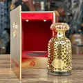 Emeer Lattafa golden woody scented fragrance decorative open case wooden tabletop closeup