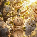 Fakhar Extrait Lattafa men fragrance elegant gold glass white blossoms sunlit backdrop