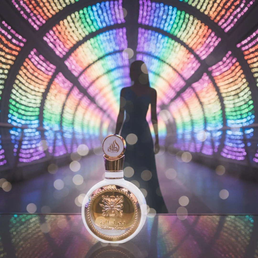 Fakhar Rose Gold Lattafa perfume bottle on table colourful tunnel woman silhouette walking