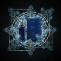 Hayaati Al Maleky Lattafa dark blue cologne packaging surrounded smoke gold geometric black